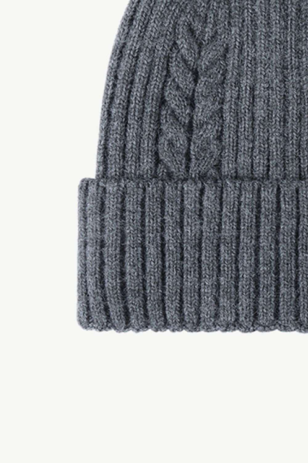 Left side view of dark gray Cable-Knit Cuff Beanie, highlighting the textured knit design and fold-over cuff for a cozy and stylish winter accessory.