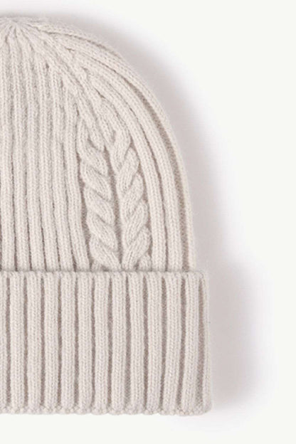 Side view of white Cable-Knit Cuff Beanie, showcasing the textured knit pattern and fold-over cuff, perfect for a warm and stylish winter look.