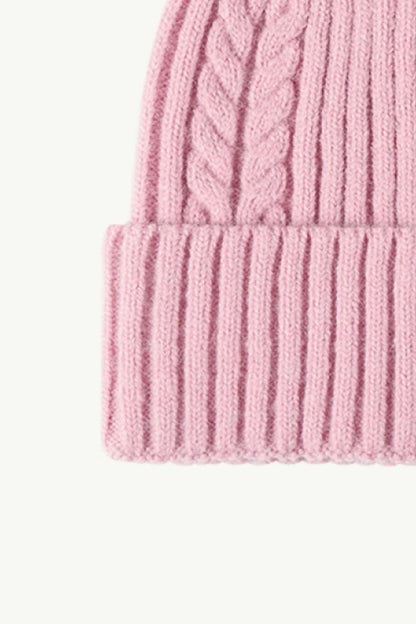 Opposite side view of pink Cable-Knit Cuff Beanie, highlighting the textured knit pattern and fold-over cuff for a warm and fashionable winter accessory.