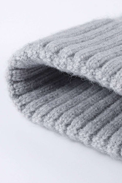 Close-up of Cable-Knit Cuff Beanie highlighting the intricate textured knit pattern and fold-over cuff, showcasing the high-quality craftsmanship and cozy winter style. - Gray 