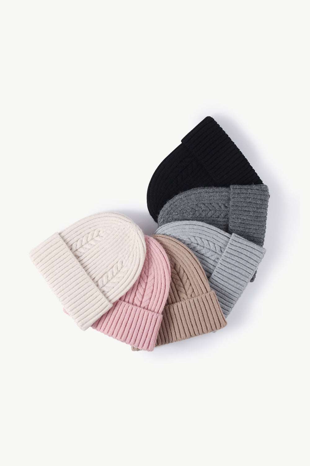 Collection of Cable-Knit Cuff Beanies in various colors, displayed together to show the range of stylish options, each with a cozy, textured knit and fold-over cuff.