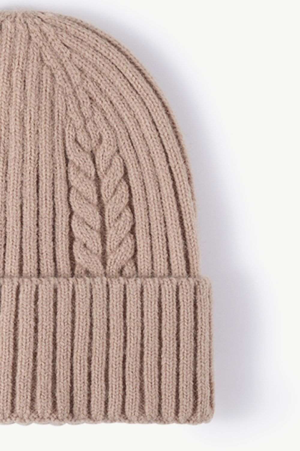 Side view of beige Cable-Knit Cuff Beanie, highlighting the soft textured knit and fold-over cuff for a warm, stylish winter look.